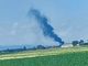La nube di fumo in lontananza del trattore in fiamme a Moretta
