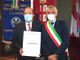 Un'immagine del giugno scorso: l'avvocato Marasso riceve dal sindaco Bo l'Ordine al Merito della Repubblica [Foto Mauro Gallo]