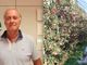 Il presidente dell'Associazione Organizzazioni Produttori (Aop) del Piemonte, Domenico Sacchetto, e un impianto di mele da raccogliere