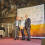 Alberto Biraghi con il figlio William ritirano il premio al festival dei formaggi piemontesi
