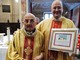 A sinistra don Angelo Testa, festeggiato a Santa Cristina di Tarantasca per i suoi 70 anni di sacerdozio