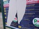 Nella foto i manifesti strappati che annunciano la festa democratica 2022, a Bra
