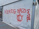 Una delle scritte apparse all'hub vaccinale del Movicentro di Cuneo Una delle scritte apparse all'hub vaccinale del Movicentro di Cuneo